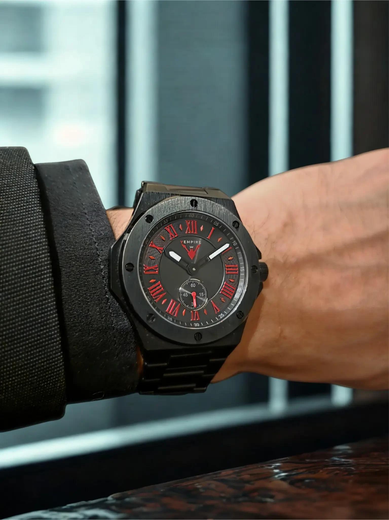 Vempire Shadow black red steel watch worn on wrist indoors
