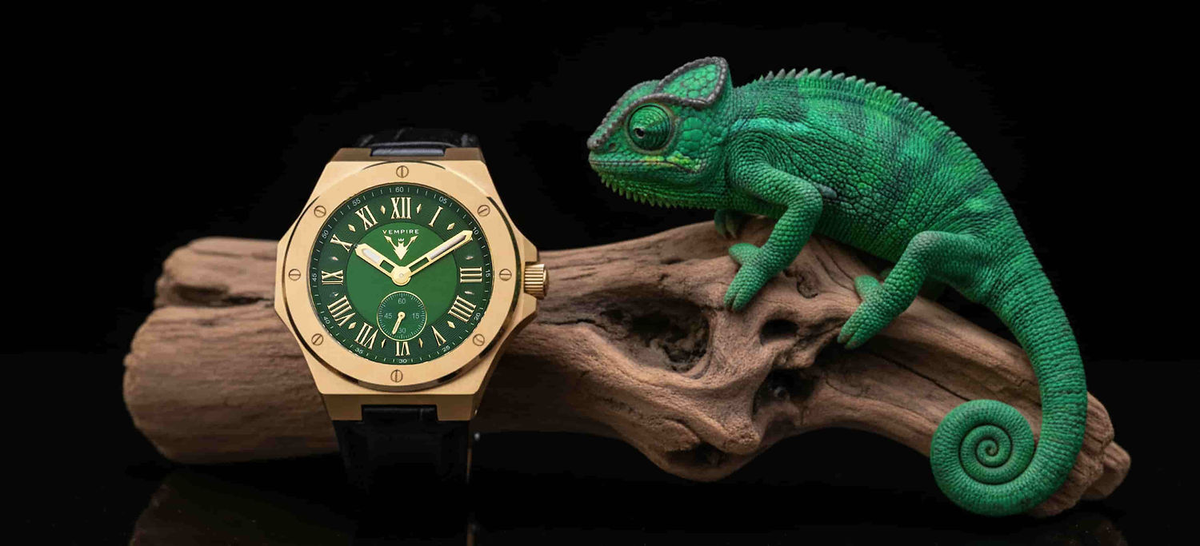 Vempire Venom gold green leather watch next to green chameleon on wood